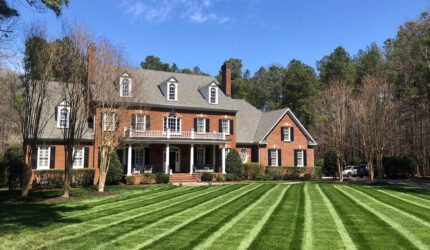 beautiful home with manicured lawn
